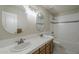 Traditional bathroom with a double sink vanity, white countertops, tiled flooring, and a tub-shower combination at 1838 W Enfield Way, Chandler, AZ 85286