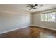 Simple bedroom design with hardwood floors, natural light, and a minimalist aesthetic at 1838 W Enfield Way, Chandler, AZ 85286