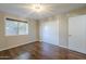 Cozy bedroom with wood flooring, closet and a window at 1838 W Enfield Way, Chandler, AZ 85286