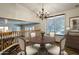 Second story view of dining room with hardwood table set and chandelier lighting at 1838 W Enfield Way, Chandler, AZ 85286
