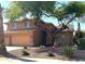 Two-story home with desert landscaping, brick accents, and a spacious two-car garage at 1838 W Enfield Way, Chandler, AZ 85286