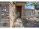 Welcoming front entrance with brick accents and covered walkway to front door at 1838 W Enfield Way, Chandler, AZ 85286