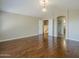 Bright living room boasting hardwood floors, vaulted ceilings, and a decorative light fixture at 1838 W Enfield Way, Chandler, AZ 85286