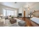 Bright living room featuring wood floors, large bay windows, and comfortable seating at 1838 W Enfield Way, Chandler, AZ 85286
