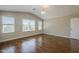 Inviting living room showcases wood floors and large windows providing ample natural light at 1838 W Enfield Way, Chandler, AZ 85286