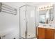 Bathroom featuring a glass-enclosed shower, a mirrored vanity and a white toilet at 18644 N 5Th Ave, Phoenix, AZ 85027