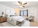 Bright bedroom featuring a ceiling fan, large window, and neutral decor at 18644 N 5Th Ave, Phoenix, AZ 85027