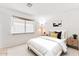 Bedroom featuring a bed, window with blinds, and neutral decor at 18644 N 5Th Ave, Phoenix, AZ 85027