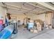Spacious garage featuring ample storage, including a washer, dryer, shelving, and a water heater at 18644 N 5Th Ave, Phoenix, AZ 85027