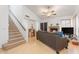 Inviting living room with wood floors, fireplace, and staircase leading to the second floor at 18644 N 5Th Ave, Phoenix, AZ 85027