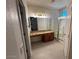 Bathroom features granite countertop vanity and tiled shower with glass enclosure at 20985 N 81St Dr, Peoria, AZ 85382