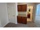 Hallway with storage and a glimpse into the connected bedroom and bathroom at 20985 N 81St Dr, Peoria, AZ 85382