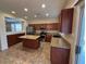 Charming kitchen with granite countertops, stainless appliances, and an island with breakfast bar at 20985 N 81St Dr, Peoria, AZ 85382