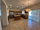 Charming kitchen with granite countertops, stainless appliances, and an island with breakfast bar at 20985 N 81St Dr, Peoria, AZ 85382
