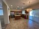 Charming kitchen with granite countertops, stainless appliances, and an island with breakfast bar at 20985 N 81St Dr, Peoria, AZ 85382