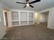 Spacious living room with contemporary design and built in shelving at 20985 N 81St Dr, Peoria, AZ 85382