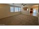 Open floorplan featuring the living room with large windows and kitchen view at 20985 N 81St Dr, Peoria, AZ 85382