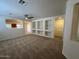 Spacious living room with contemporary design and built in shelving at 20985 N 81St Dr, Peoria, AZ 85382