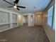 Spacious living room featuring built in shelving, neutral colors and large windows at 20985 N 81St Dr, Peoria, AZ 85382