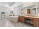 Bright bathroom features a soaking tub, vanity area, and large mirror at 2144 E Honeysuckle Pl, Chandler, AZ 85286