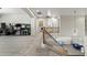 Open loft space features arcade games, plush carpet, and a comfortable seating area, perfect for entertainment at 2144 E Honeysuckle Pl, Chandler, AZ 85286