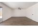 Spacious bedroom featuring laminate flooring, ceiling fan, and sliding patio door at 2220 S Cottonwood Dr, Tempe, AZ 85282