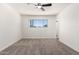Carpeted bedroom featuring natural light, ceiling fan, and neutral decor at 2220 S Cottonwood Dr, Tempe, AZ 85282