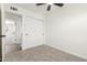 Carpeted bedroom featuring a ceiling fan and walk in closet at 2220 S Cottonwood Dr, Tempe, AZ 85282