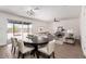 Open-concept dining area featuring wood floors, a large table, and a view to the living room at 2220 S Cottonwood Dr, Tempe, AZ 85282