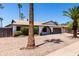 Charming single-story home with a well-manicured desert landscape and arched entryway, creating curb appeal at 2220 S Cottonwood Dr, Tempe, AZ 85282
