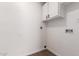 Clean laundry room with white walls, connections, and laminate flooring at 2220 S Cottonwood Dr, Tempe, AZ 85282