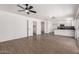 Bright, open floor plan connects the living area to the kitchen, complete with laminate flooring at 2220 S Cottonwood Dr, Tempe, AZ 85282