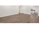 Spacious living room with stylish laminate flooring, fresh paint and abundant natural light at 2220 S Cottonwood Dr, Tempe, AZ 85282