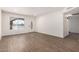 Bright living room featuring laminate flooring, fresh paint and a new front door at 2220 S Cottonwood Dr, Tempe, AZ 85282