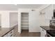 Walk in pantry with multiple shelves adjacent to the kitchen at 2220 S Cottonwood Dr, Tempe, AZ 85282