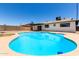 Backyard view showcasing a sparkling pool with a concrete deck, and a covered patio area of the house at 2220 S Cottonwood Dr, Tempe, AZ 85282