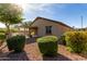Private backyard featuring a covered patio, desert landscaping, and ample space for outdoor activities at 22417 W Loma Linda Blvd, Buckeye, AZ 85326