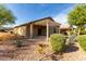 Serene backyard with a covered patio, desert landscaping, and scenic views for relaxing outdoor enjoyment at 22417 W Loma Linda Blvd, Buckeye, AZ 85326