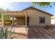 Enjoy outdoor living in this backyard featuring a covered patio, desert landscaping, and a well-maintained exterior at 22417 W Loma Linda Blvd, Buckeye, AZ 85326