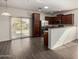 Stylish kitchen boasting stainless steel appliances, dark wood cabinets, and an open design for easy entertaining at 22417 W Loma Linda Blvd, Buckeye, AZ 85326