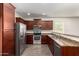 Modern kitchen featuring stainless steel appliances, granite countertops, and ample cabinet space for storage and meal prep at 22417 W Loma Linda Blvd, Buckeye, AZ 85326