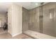 Modern shower with glass surround, neutral tiling, and high-end shower head at 2300 E Campbell Ave # 114, Phoenix, AZ 85016