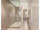 Contemporary bathroom boasts an enclosed glass shower and bright cabinets at 2300 E Campbell Ave # 114, Phoenix, AZ 85016
