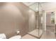Contemporary bathroom boasts an enclosed glass shower and bright cabinets at 2300 E Campbell Ave # 114, Phoenix, AZ 85016