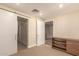 Neutral bedroom featuring barn door and storage with shelves at 2300 E Campbell Ave # 114, Phoenix, AZ 85016