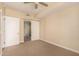 Bedroom featuring neutral carpet and door leading to an ensuite bathroom at 2300 E Campbell Ave # 114, Phoenix, AZ 85016