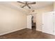 Bright bedroom featuring modern ceiling fan, hardwood floors, and ensuite bathroom at 2300 E Campbell Ave # 114, Phoenix, AZ 85016