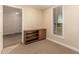 Neutral bedroom featuring bright window and storage with shelves at 2300 E Campbell Ave # 114, Phoenix, AZ 85016