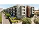 Modern apartment building with unique facade, private balconies, and lush landscaping at 2300 E Campbell Ave # 114, Phoenix, AZ 85016