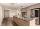 Modern kitchen features stainless steel appliances, light wood cabinets and a spacious center island with stone countertops at 2300 E Campbell Ave # 114, Phoenix, AZ 85016